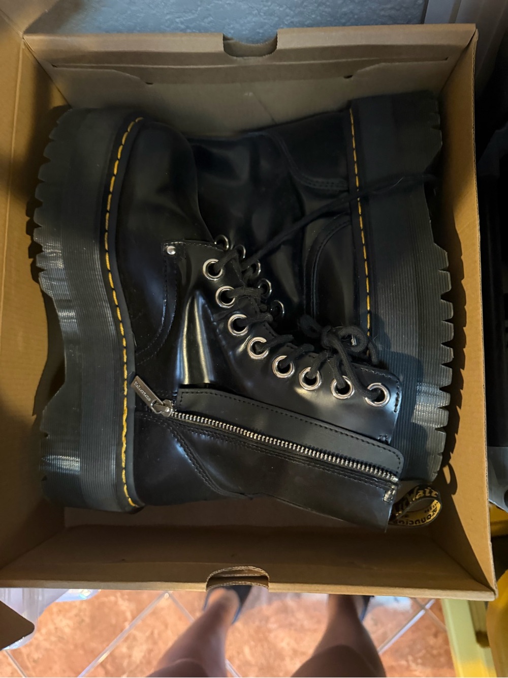 Dr. Martens Black Leather Lug-Zip Platform Boots with Yellow Welt Stitching